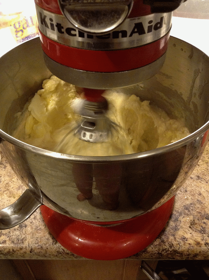 Stirring creamy cheese
