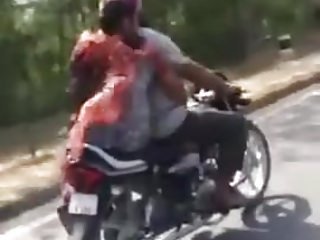 Girl gives motorcyclist handjob